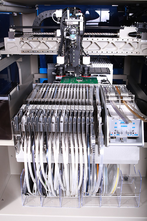Component packaging placed in Feeder machine.