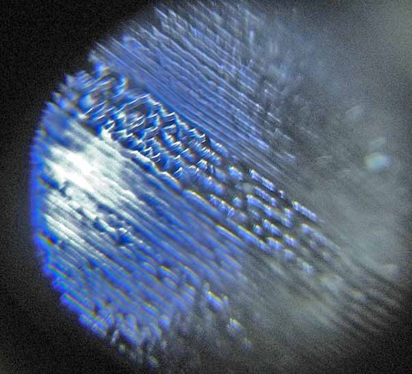 Magnified Grooves on an LP record.